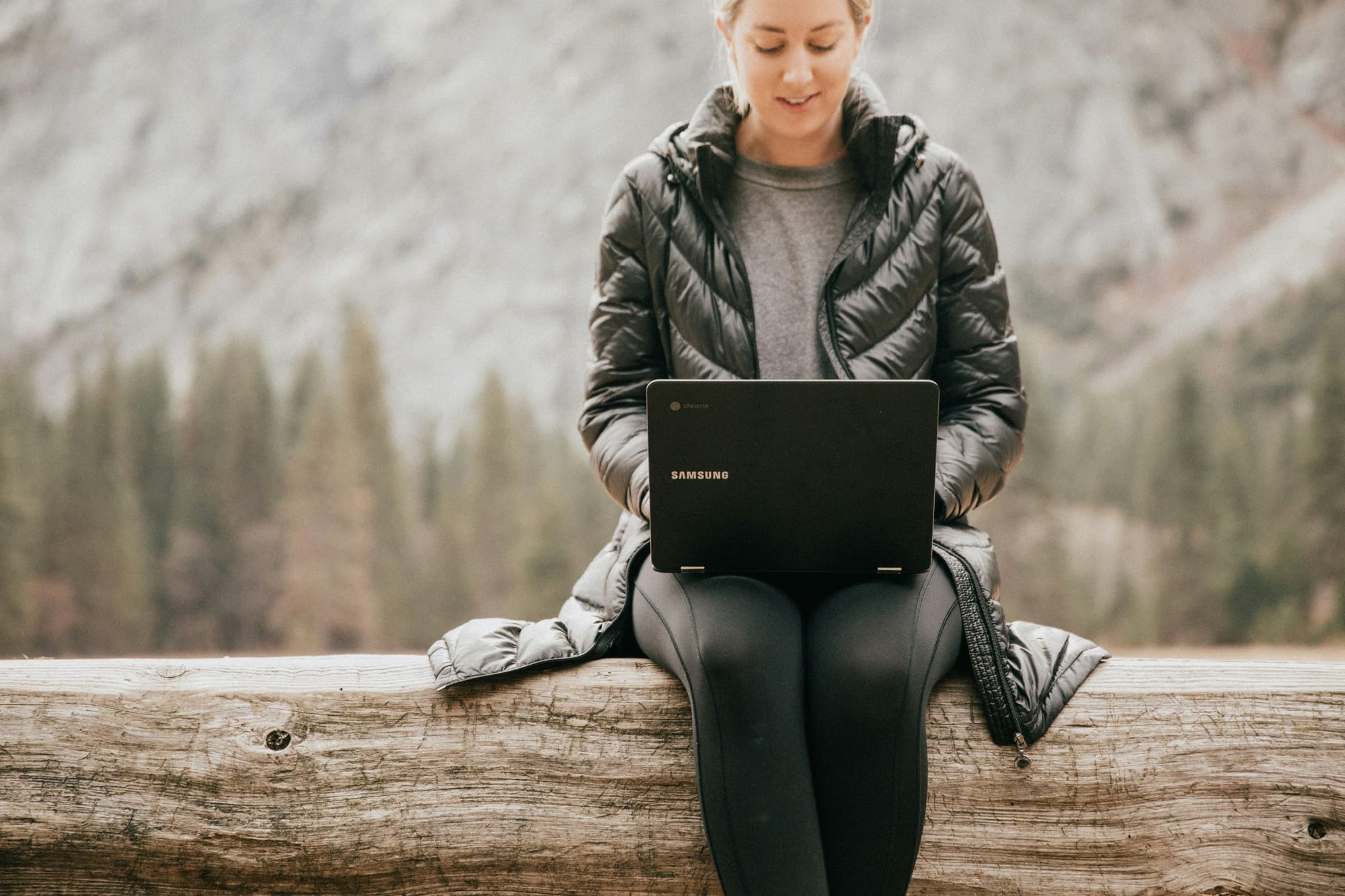 woman sitting outdoor using AI - What Is AI Writing