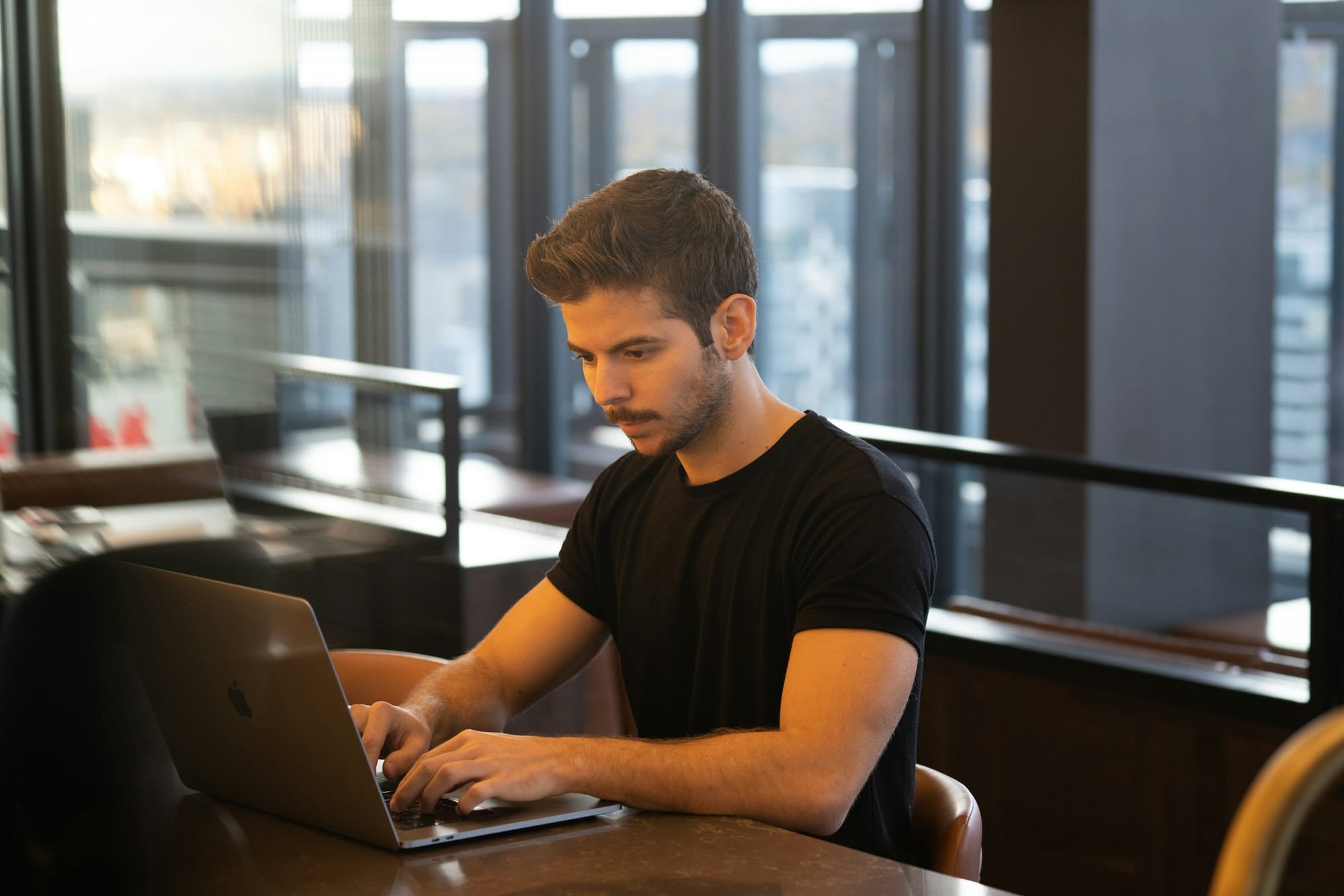 man in agency office working with AI SEO Optimization Tools