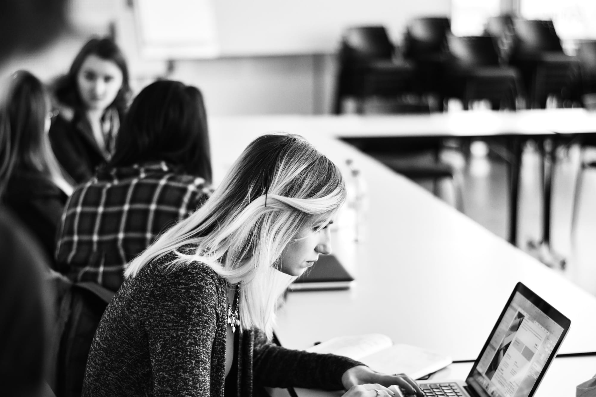 woman working hard with Best AI Writing Assistant