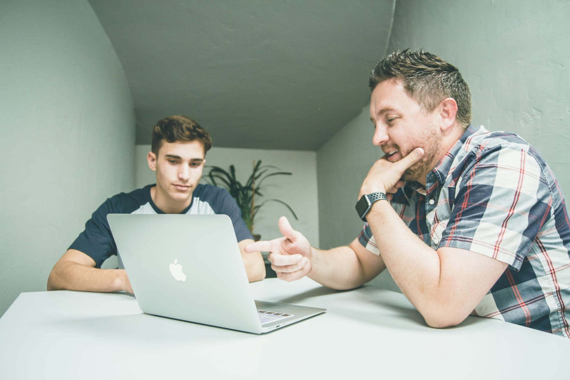 man helping junior with AI Content Strategy