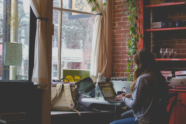 Woman Using Laptop - AI Content Writing Tools